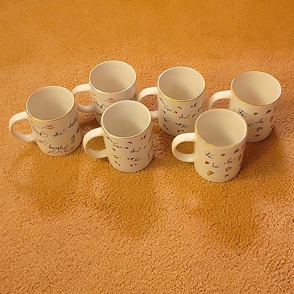 Rosanna 6 mugs with painted Deck The Halls & Falala. Gold trimmed. Looks new